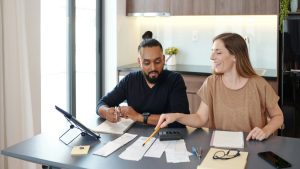 Couple managing Tips For Managing Your Money To Save Other Expenses